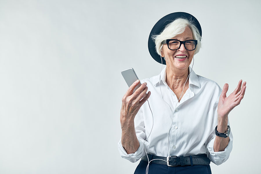 smiling woman listening to music on headphones